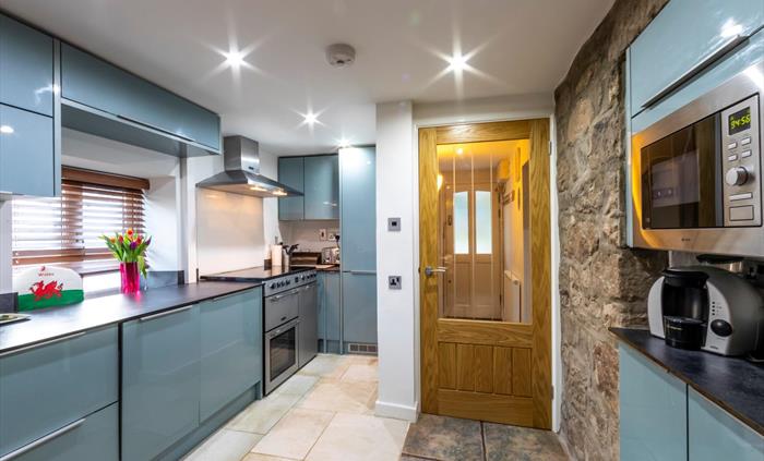 Extremely well equipped and with a large range cooker it is open plan to the dining area